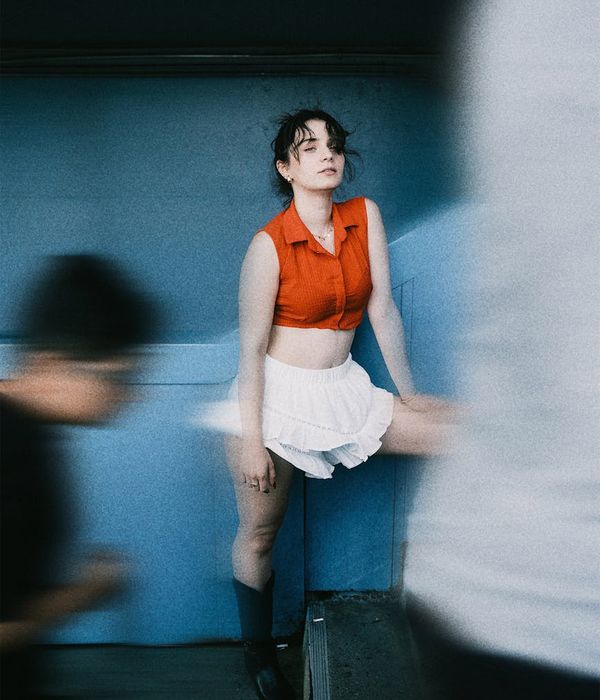 Woman in a dynamic movement pose, feeling energetic.